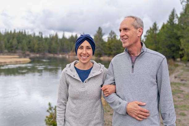 istock Beautiful mixed race woman in remission spending time outdoors with her dad 1322801131