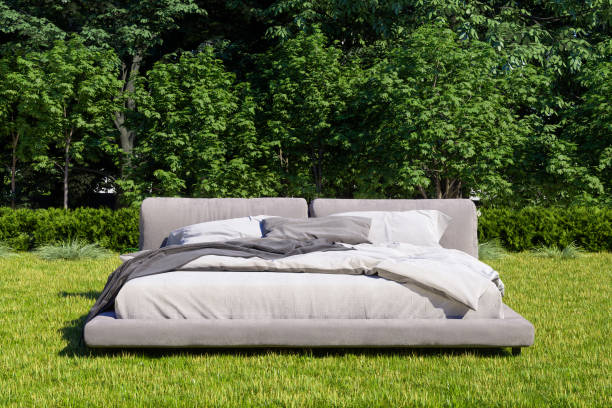 Messy Bed On The Grass In The Forest