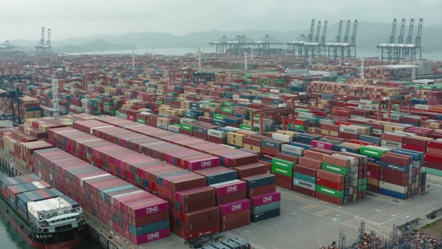 Drone view of shipping containers in a busy port