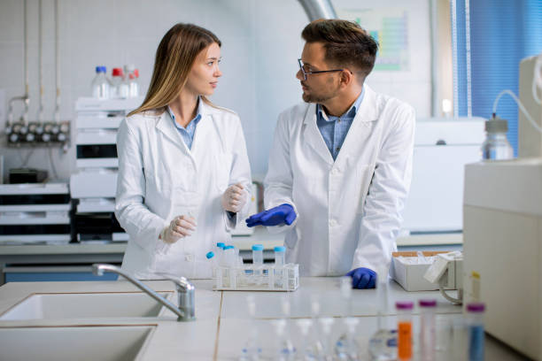 istock Group of young researchers analyzing chemical data in the laboratory 1322811001