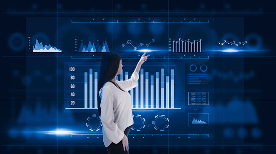 Hands of businessman analyzing sales data and economic growth graph chart on tablet and hologram screen. Business strategy and digital data, business technology, digital marketing.