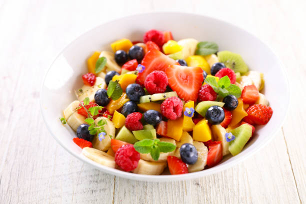 istock fresh fruit salad with berries fruits 1322818959