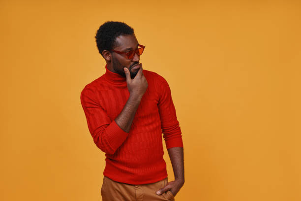 istock Stylish young African man in eyeglasses looking away 1322820669