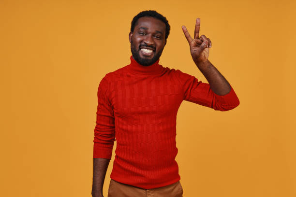 istock Handsome young African man in casual clothing gesturing and smiling 1322820672