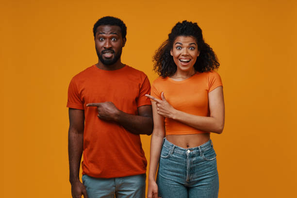 istock Beautiful young African couple gesturing and smiling 1322820795