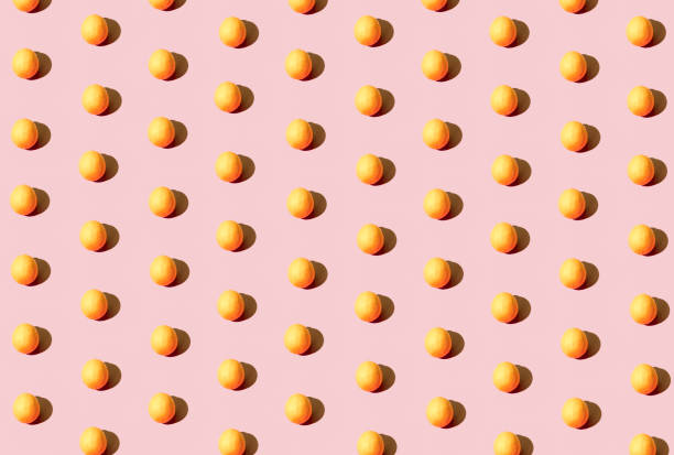 istock Creative bright summer pattern idea with a fresh organic raw lemon against pastel pink background. Minimalistic modern fruit concept, geometric arrangement. 1322822951