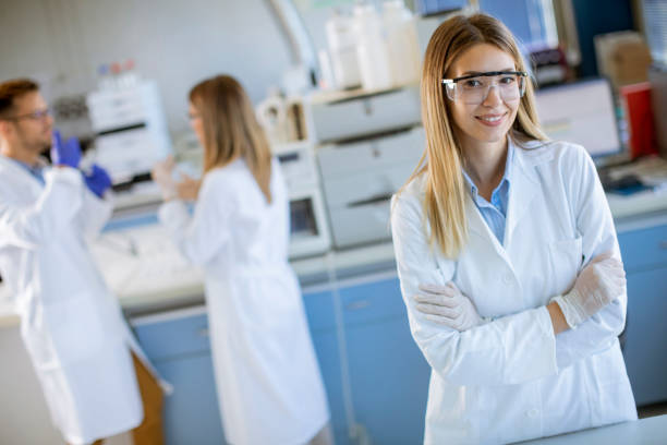 istock Female scientist in white lab coat standing in the biomedical lab 1322822985