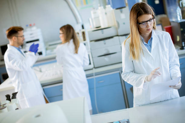 istock Female scientist in white lab coat standing in the biomedical lab 1322822989
