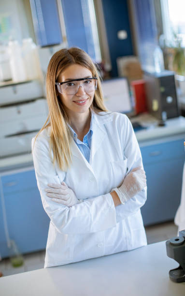 istock Female scientist in white lab coat standing in the biomedical lab 1322823051