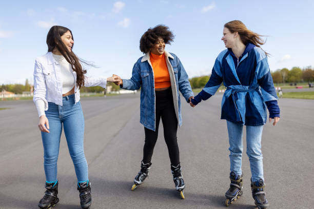 istock Female skaters on empty asphalt runway on former airport 1322824589