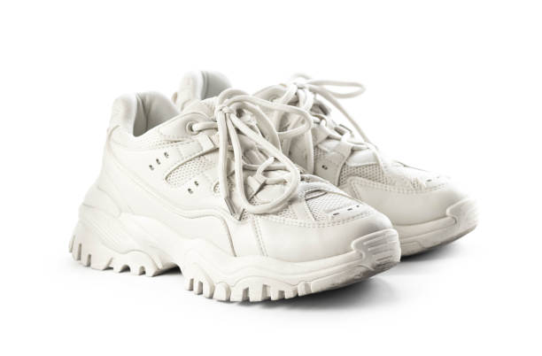 istock Light leather womens sneakers. Close up. Isolated on a white background 1322825202