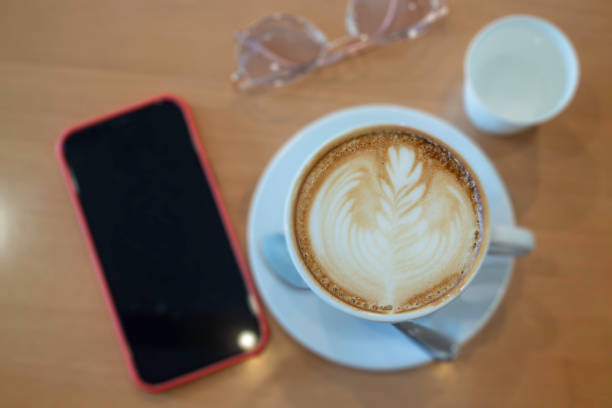Coffee cup hot latte on wooden table, stock photo