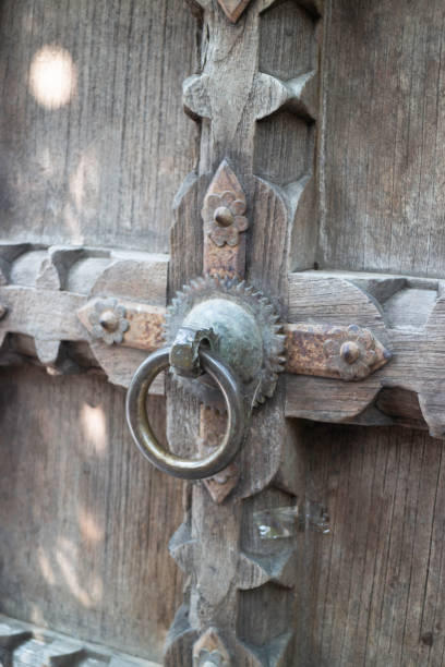 istock Old open wooden door with carved pattern 1322825748