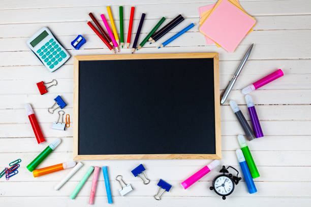 istock Various school supplies on a wooden table. 1322826021