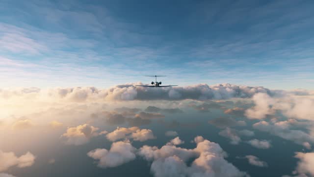 Rear view of a private airplane flying over clouds