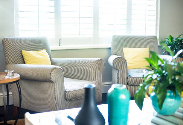 istock Sunlight streaming through windows in a comfortable living room 1322828712
