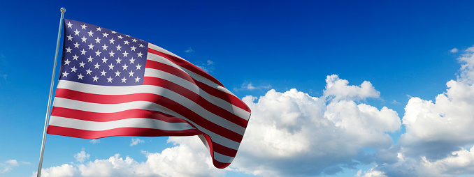 United States of America Wavy Flag and blue sky with white clouds on the background
