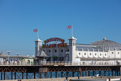 Brighton, United Kingdom - Jun 09, 2021: The Brighton Marine Palace and Pier is an amusement park in Brighton. Brighton is one of the largest and most famous seaside resorts in England.