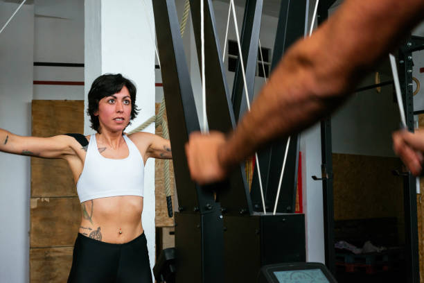 Athletic Girl Using Ski Machine During gym Workout