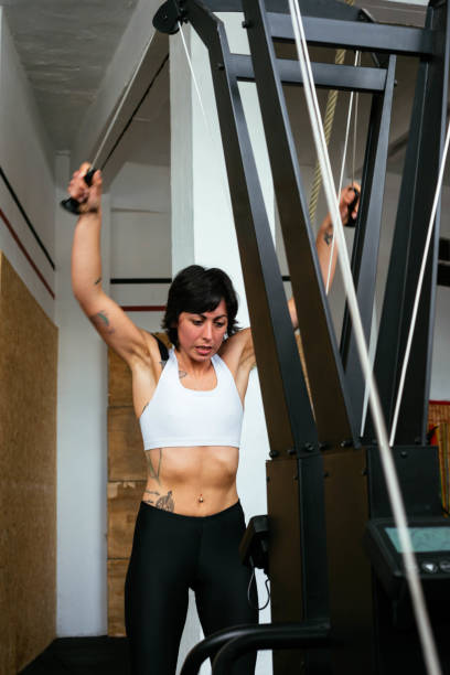 Athletic Girl Using Ski Machine During gym Workout