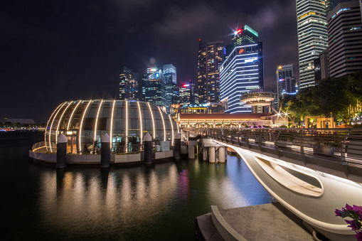 Singapore night life is full of lights. Mesmerising landscapes with tall buildings and reflective waters