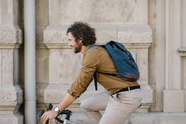 istock Young businessman commuting to work on his bicycle 1322832057