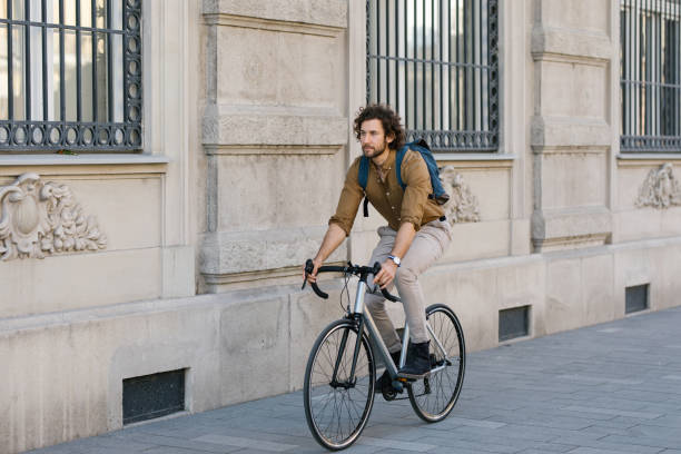 istock Handsome young man riding his bike to work 1322832468