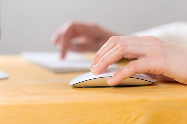 istock Close-up of young female hands pressing keyboard buttons and using a mouse. work from home. office. shopping 1322832610