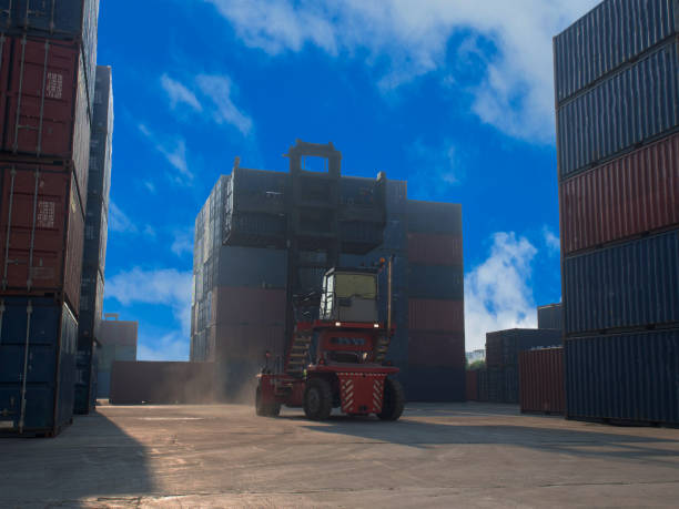istock Terminal warehouse mortgage cargo container orange color forklift crane trade engineer technology transportation company factory logistic ecommerce international import export.Sky blue cloud white 1322833345