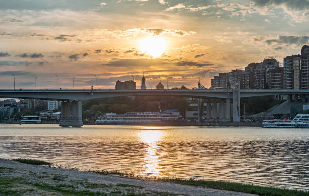 Golden sunset in Rostov-on-Don Panoramic view of evening Rostov-on-Don city with golden sunset. Voroshilovsky bridge over Don river rostov on don stock pictures, royalty-free photos & images
