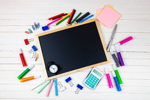 istock Various school supplies on a wooden table. 1322836067