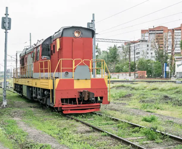 Front view of red shunting locomotive. Railroad switcher