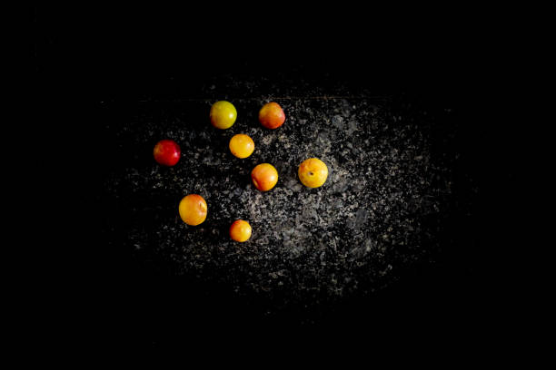 istock Plums in darkbackground marble lookalike great wallpaper 1322837083