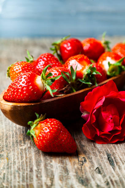 istock Ripe strawberries and rose 1322837179