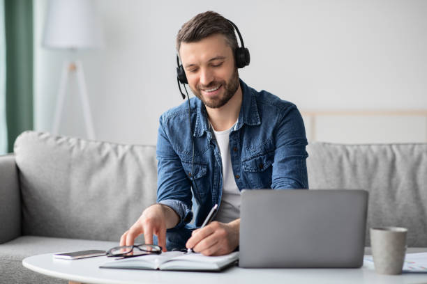 istock Positive middle-aged man attending online training from home 1322838831