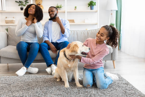 istock Animal Allergy. Sad black parents scratching their necks 1322839688
