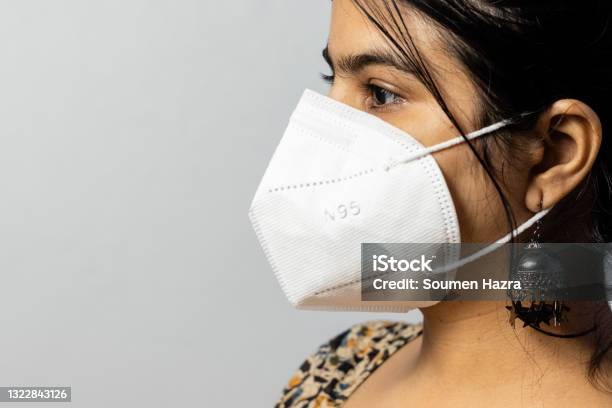 Woman In N 95 Nose Mask Stock Photo - Download Image Now - N95 Face Mask, Protective Face Mask, One Woman Only