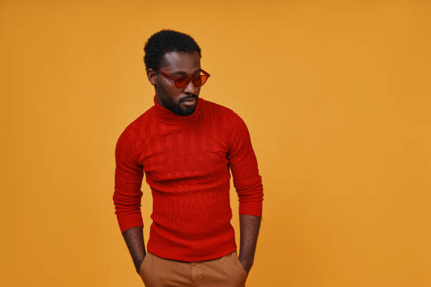 istock Stylish young African man in eyeglasses looking away 1322843816