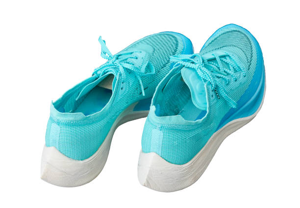 istock teal aqua running shoes isolated on white back top view 1322844096