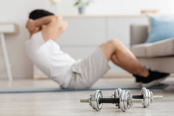 istock Strength training, workout at home during COVID-19 lockdown 1322844225
