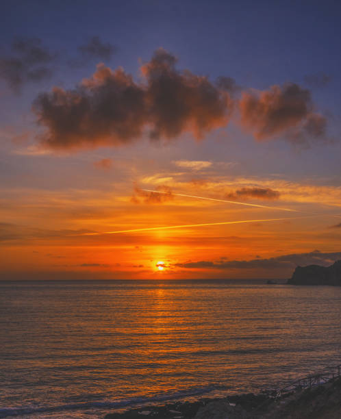 istock Sunrise over Cala Blanca Beach 1322845864