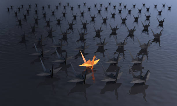 istock Standing Out From The Crowd With Paper Cranes 1322845872
