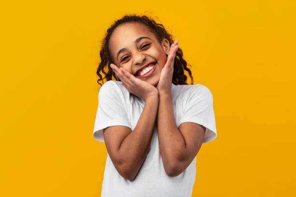 istock Cute Joyful African American Girl Touching Cheeks 1322846054