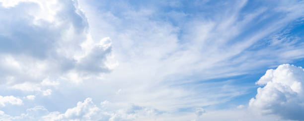 istock blue sky background with clouds. bright natural sky 1322847115