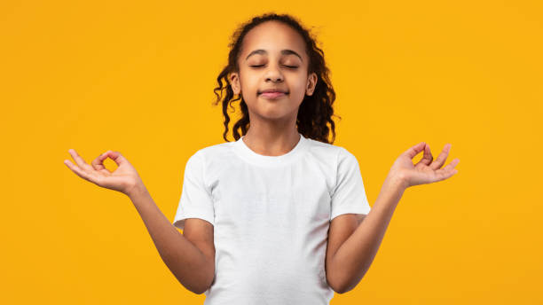 istock Little black girl doing yoga at studio 1322847204