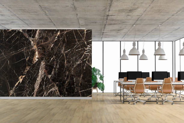istock Empty office interior with copy space and wordesks on hardwood floor 1322848589