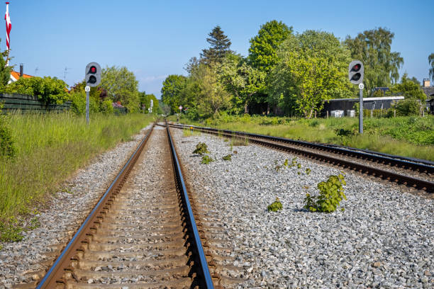 istock Railroad tracks in summer landscape 1322848630