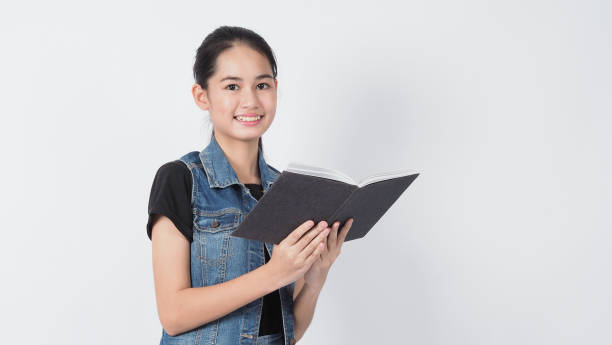istock Asian Young woman gesture posing on white background. represent cheerful and confident. Showing gestures such as mini heart Okay Thumb up or point out. Happy amazed excited and surprised Jacket jeans. 1322848802