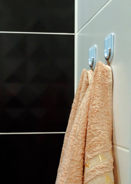 istock Bathroom hooks with hanging beige towels for shower 1322849638