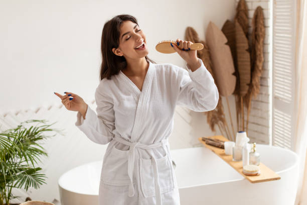 istock Brunette Lady Singing Posing With Hairbrush Having Fun In Bathroom 1322852411